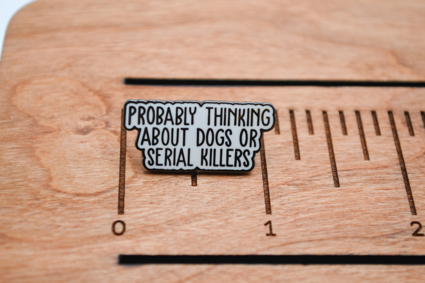 Probably Thinking About Dogs or Serial Killers Enamel Pin