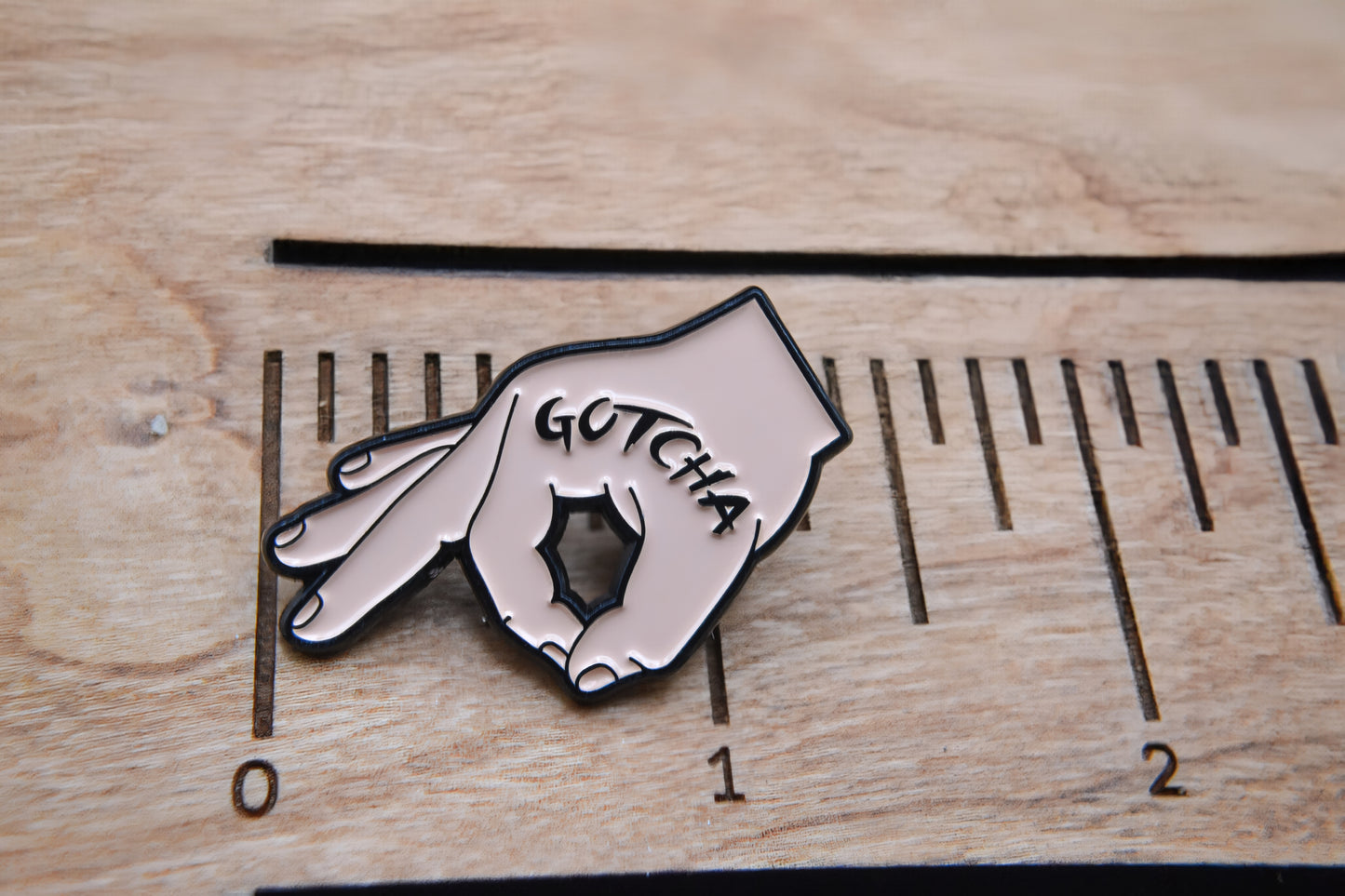 Gotcha Enamel Lapel Pin