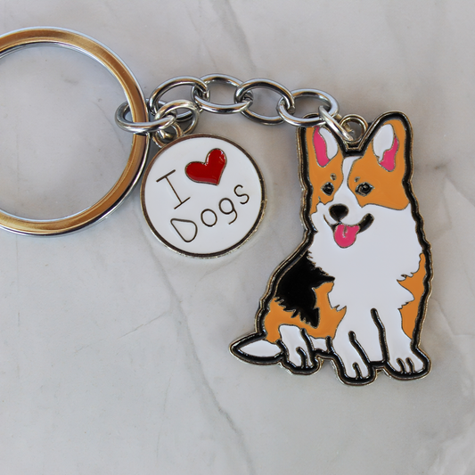Keychain with a corgi dog charm and 'I ❤️ Dogs' tag on a light background