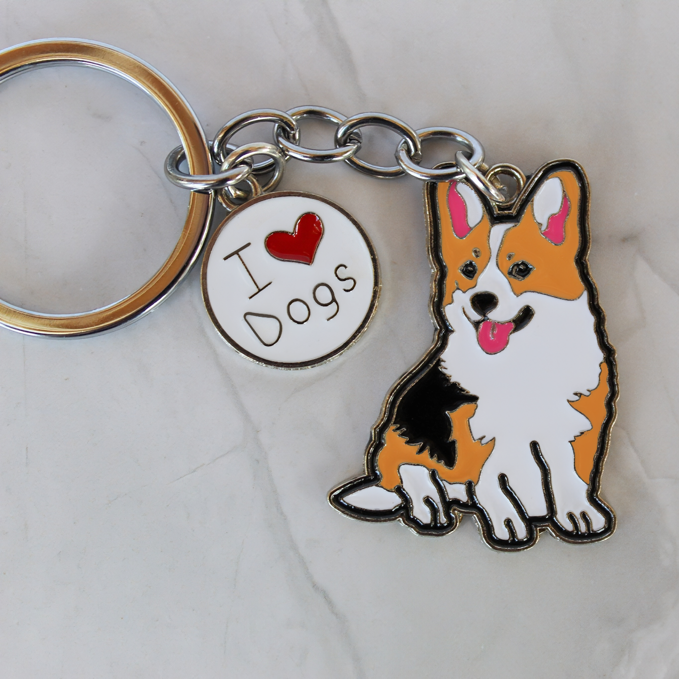 Keychain with a corgi dog charm and 'I ❤️ Dogs' tag on a light background